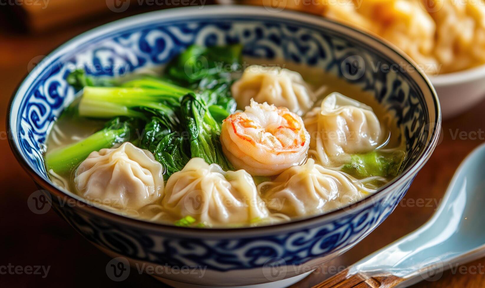 a bowl of soup with dumplings and broccoli photo