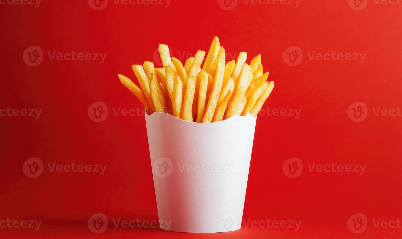 A white container with french fries in it photo