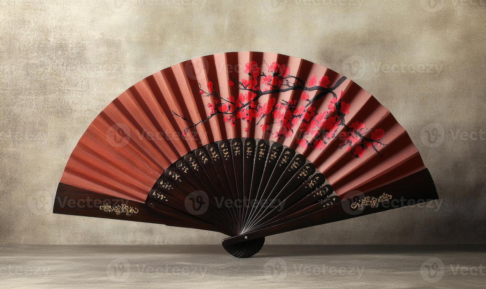 A red and brown fan with a tree design on it photo