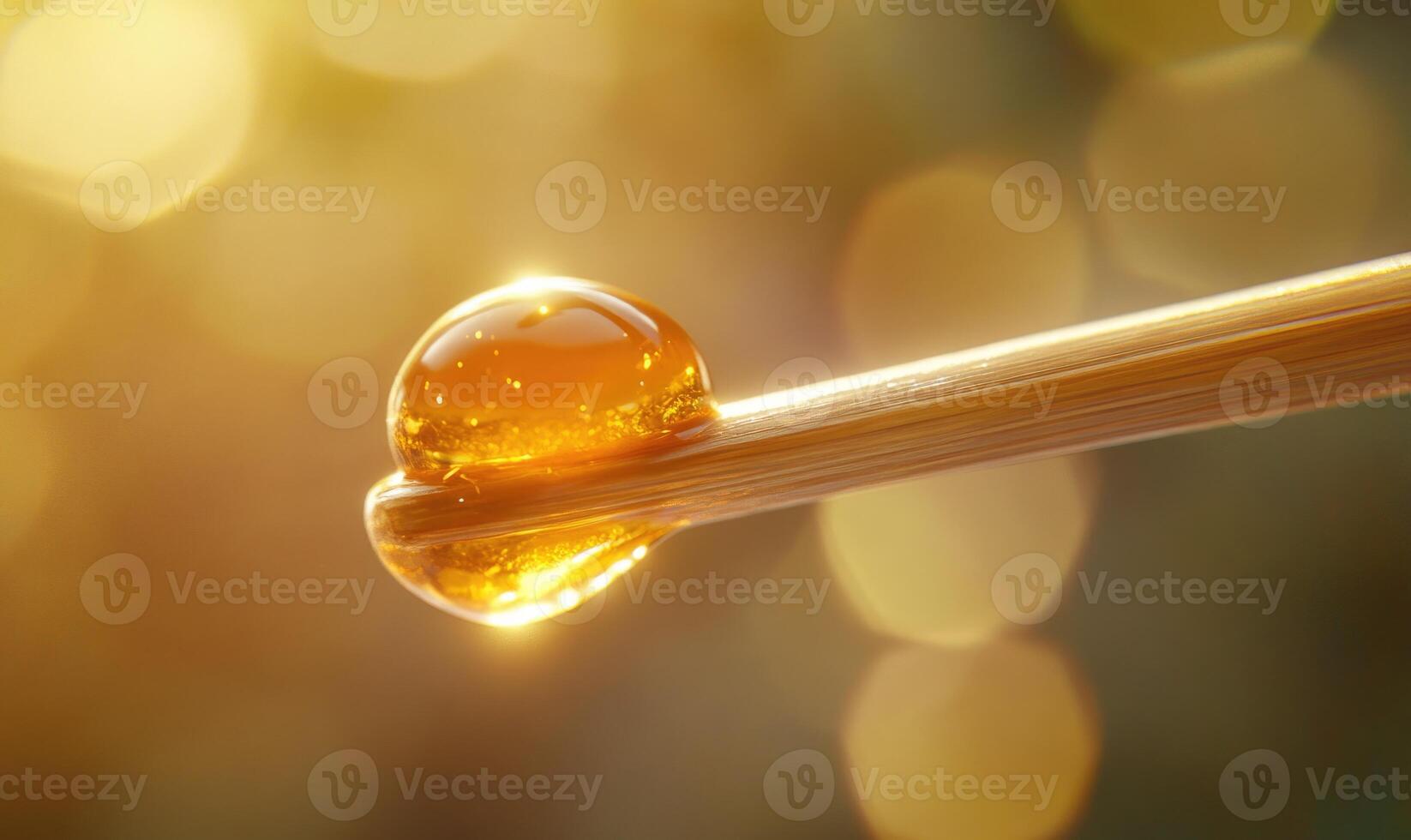 A droplet of liquid sits on a stick photo