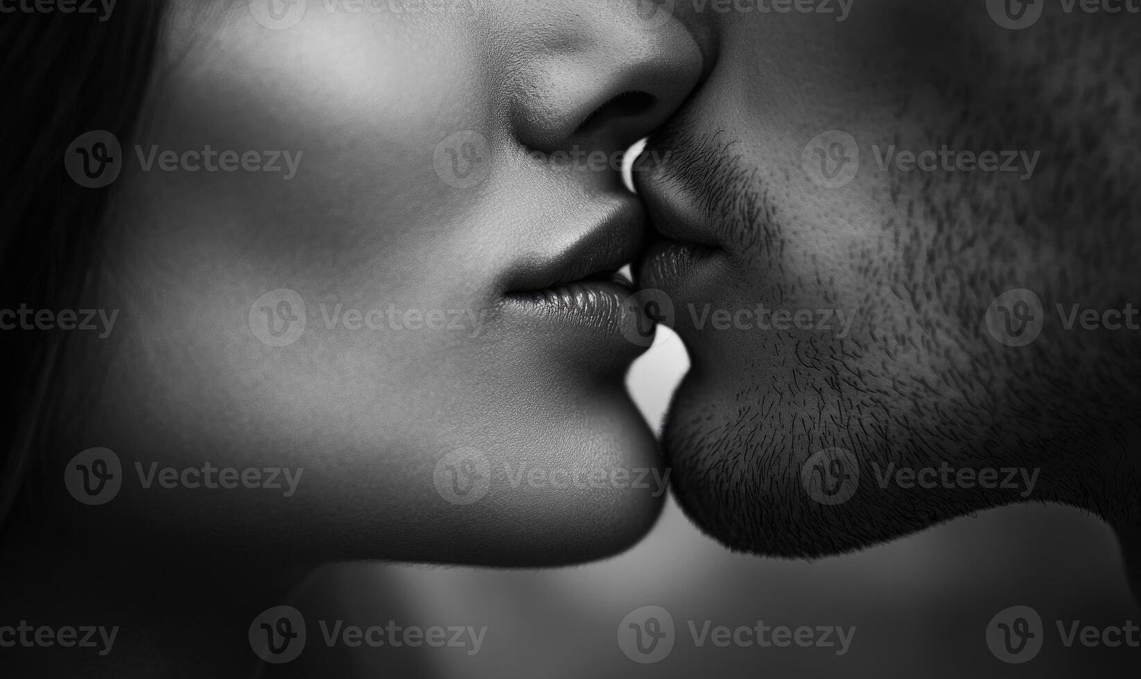 a man and woman kissing in black and white photo