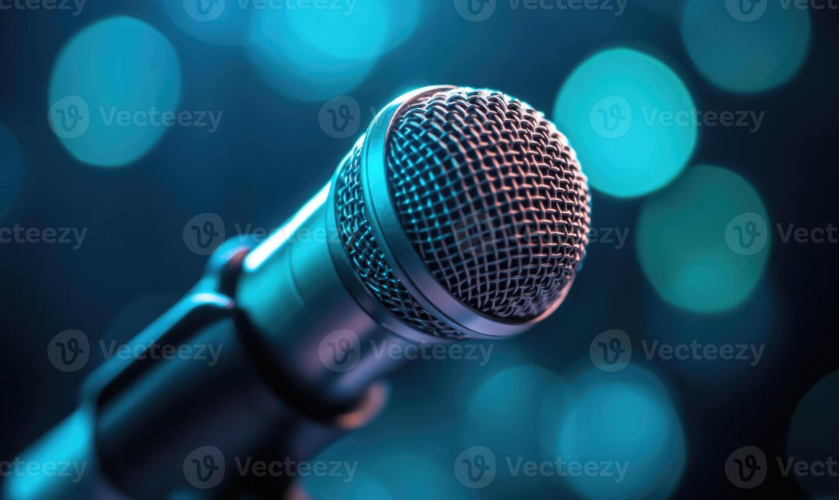 A microphone is shown in a blurry background with a blue hue photo