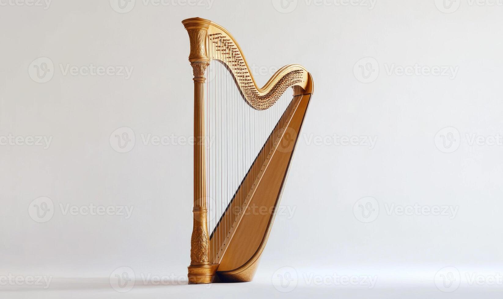 A large, curved, gold-colored harp is the main focus of the image photo