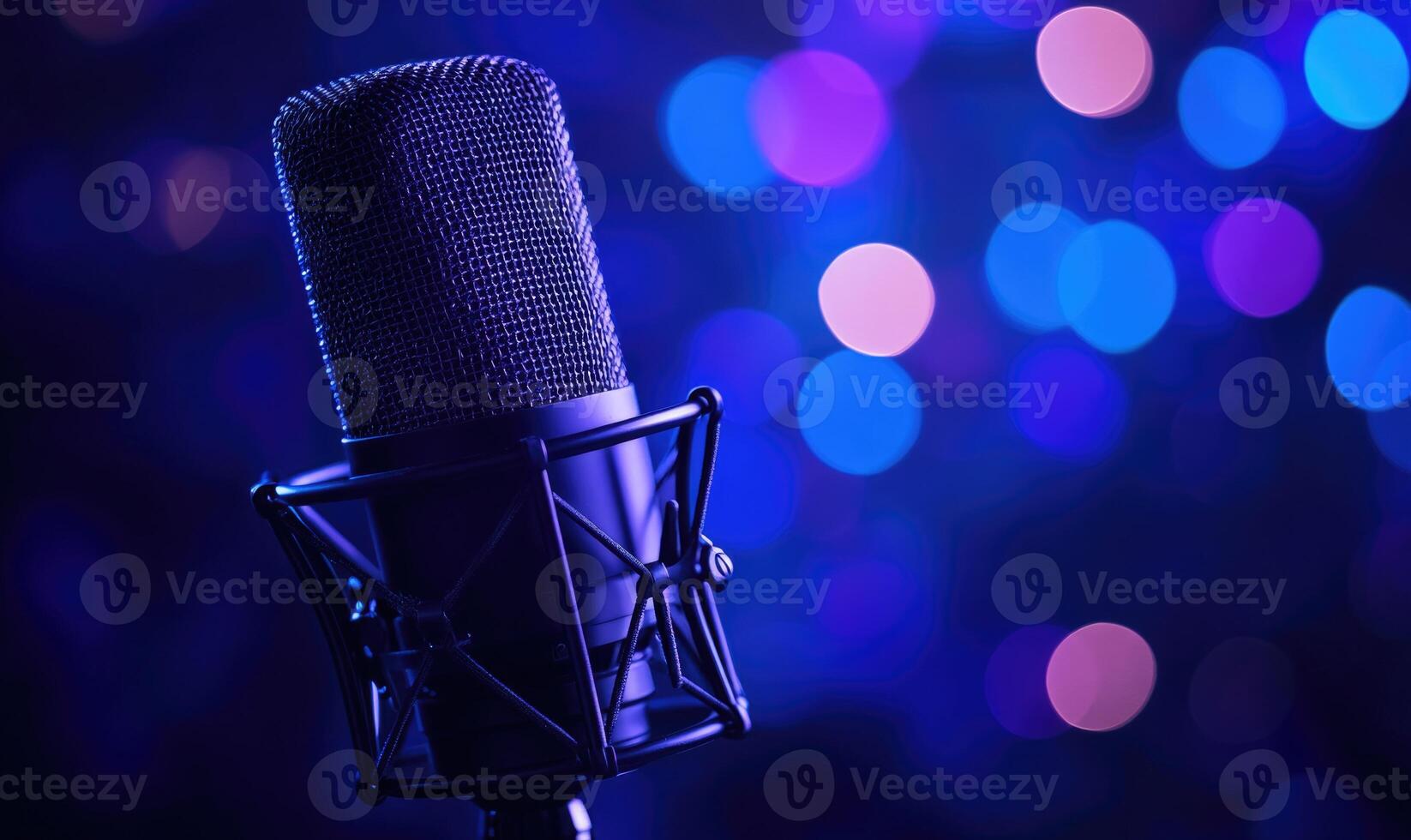 A microphone is placed on a blue background with purple and blue lights photo