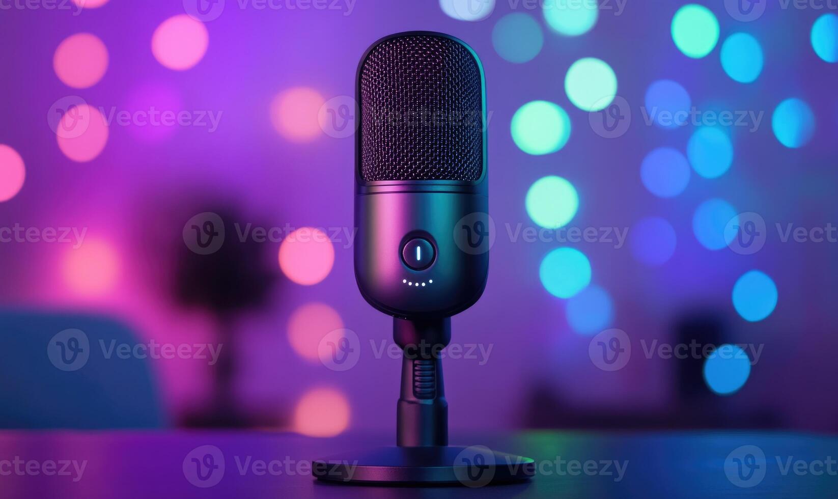 A microphone is on a table in front of a colorful background photo