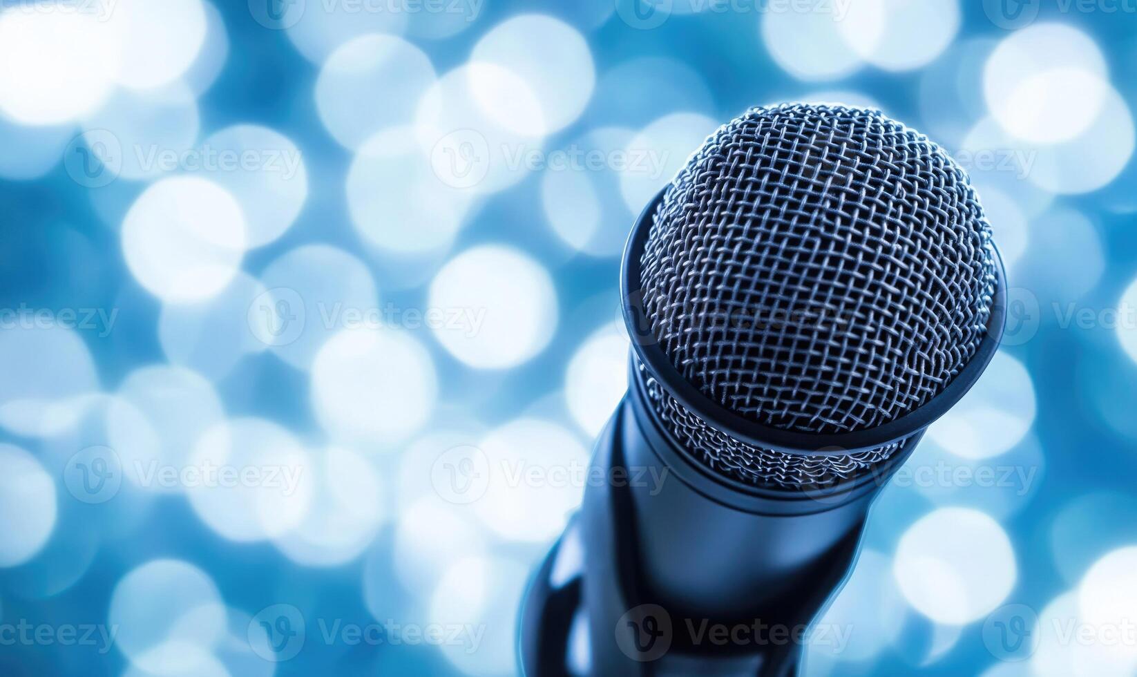 A microphone is shown with a blue background photo