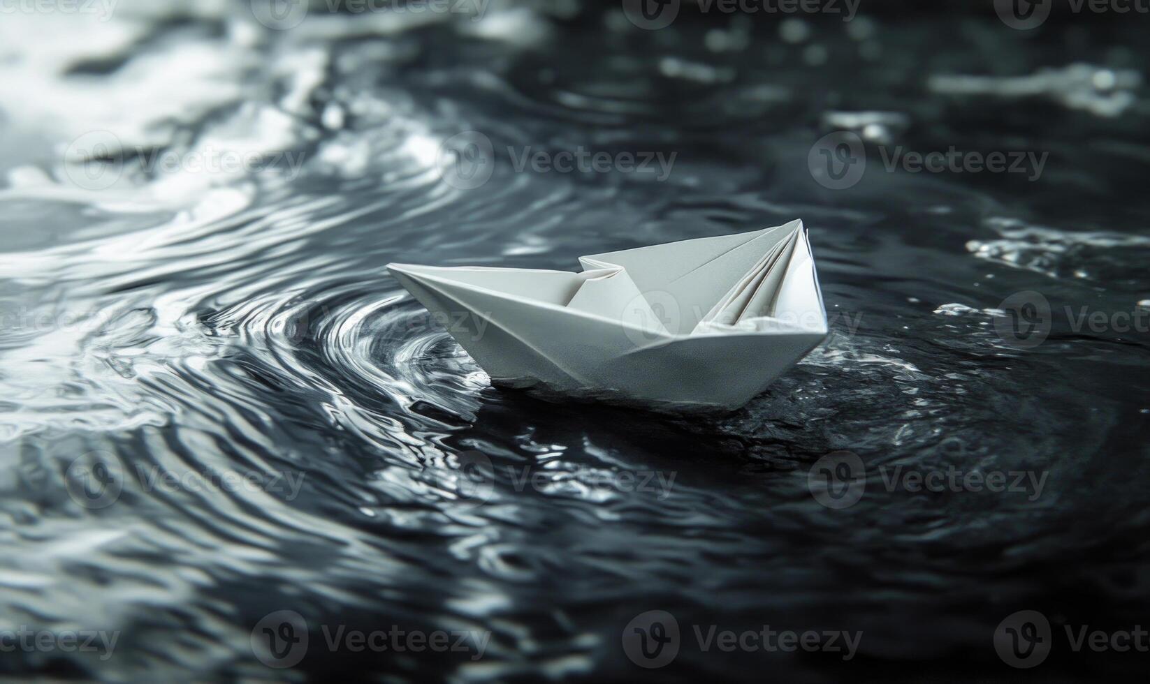 A paper boat is floating on the water closeup photo