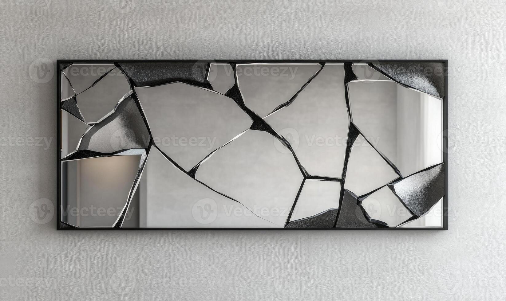 A mirror with a broken frame and a shattered reflection photo