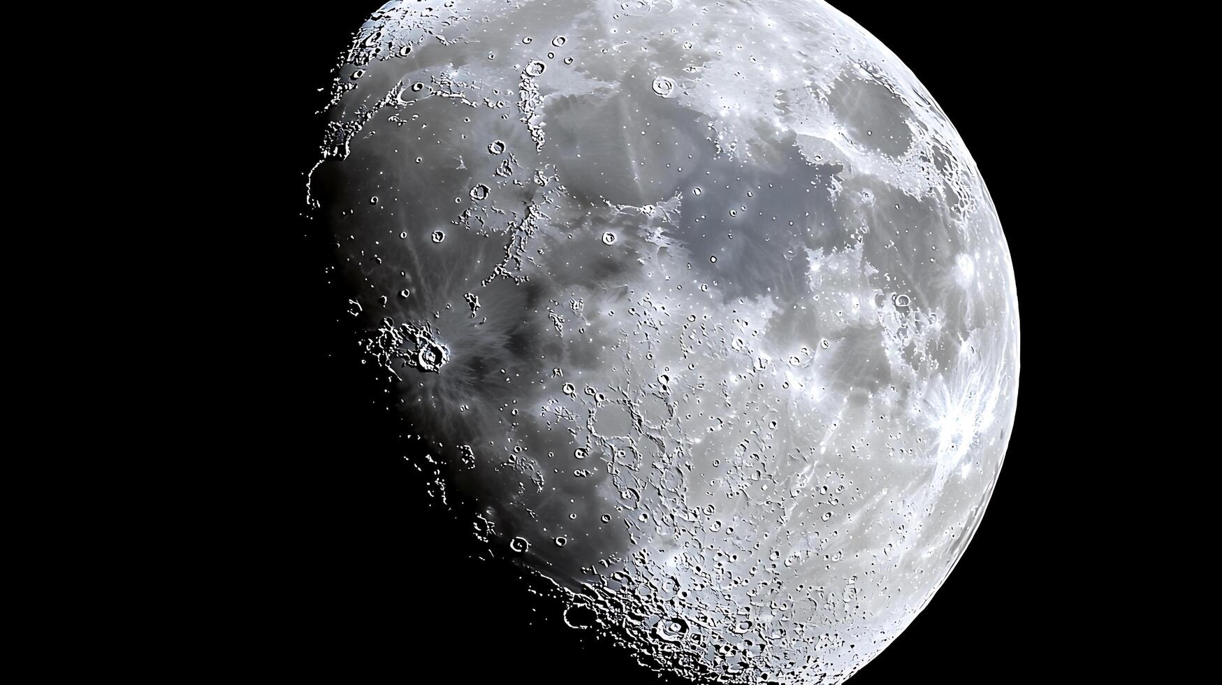 Detailed Close Up of the Moon's Surface, Showing Craters and Texture. photo