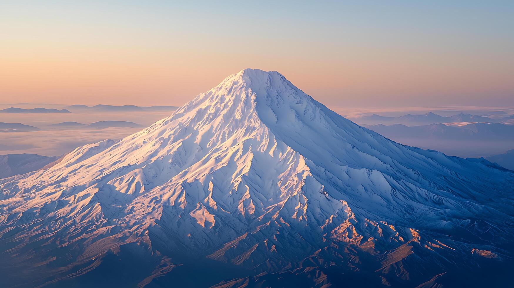 Majestic Snow-Capped Mountain Peak at Sunrise An Aerial View. photo