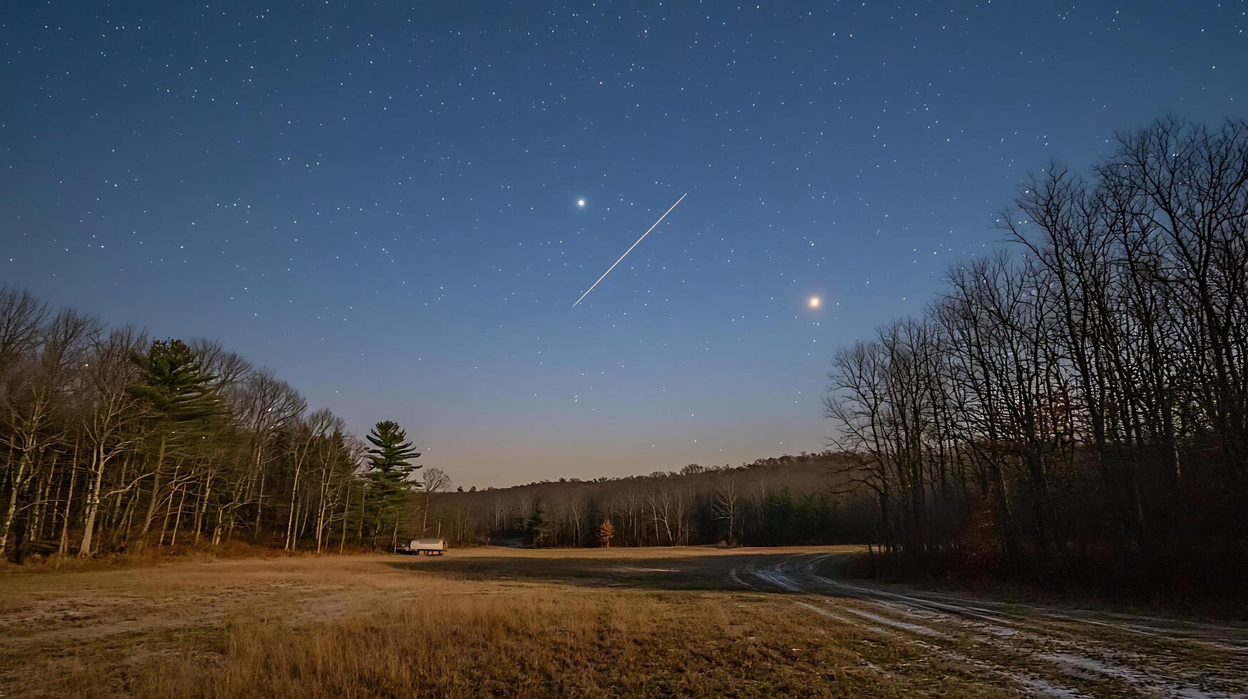 Night Sky Over a Rural Field with Shooting Star and Winter Trees. photo