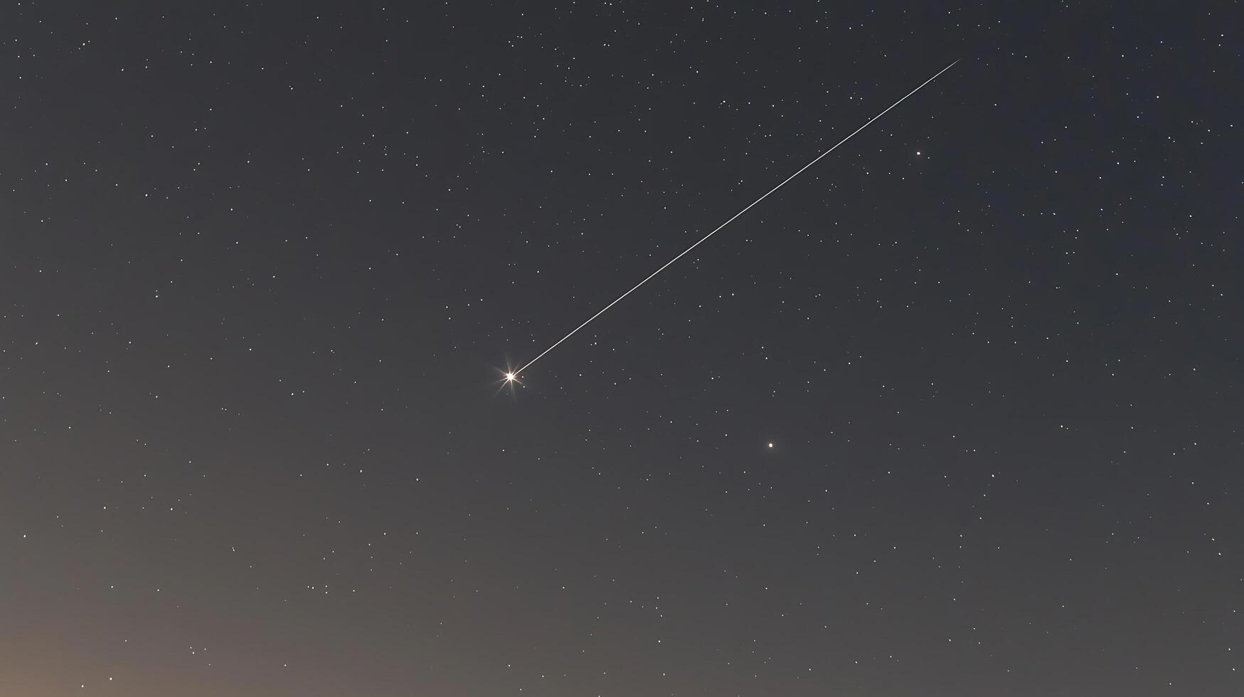 Night Sky with a Bright Meteor Trail Across a Starry Background. A Stunning Celestial Event Captured in a Long Exposure Photograph. photo