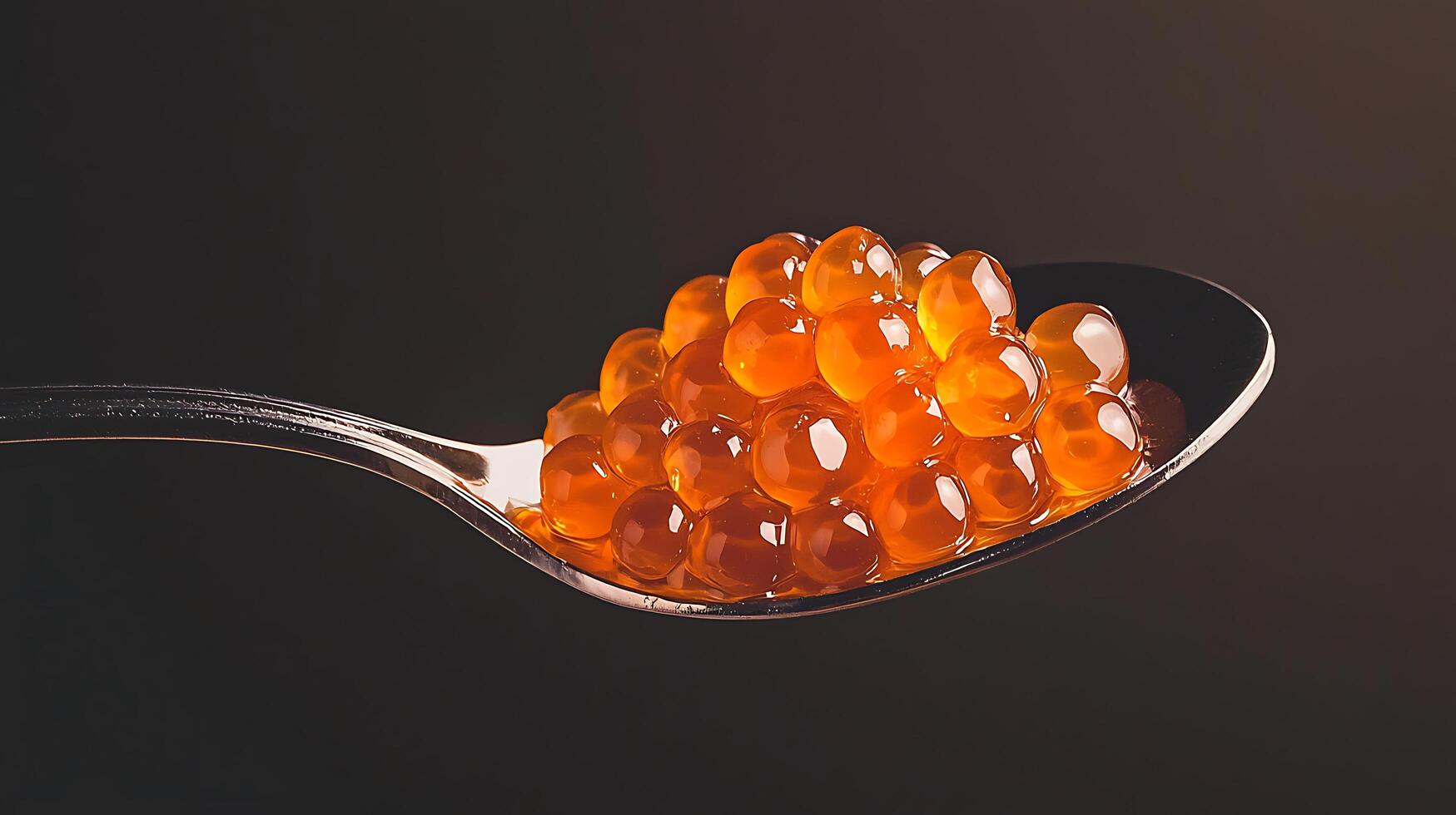 Close up of Salmon Roe on a Spoon, Luxurious Seafood Delicacy. photo