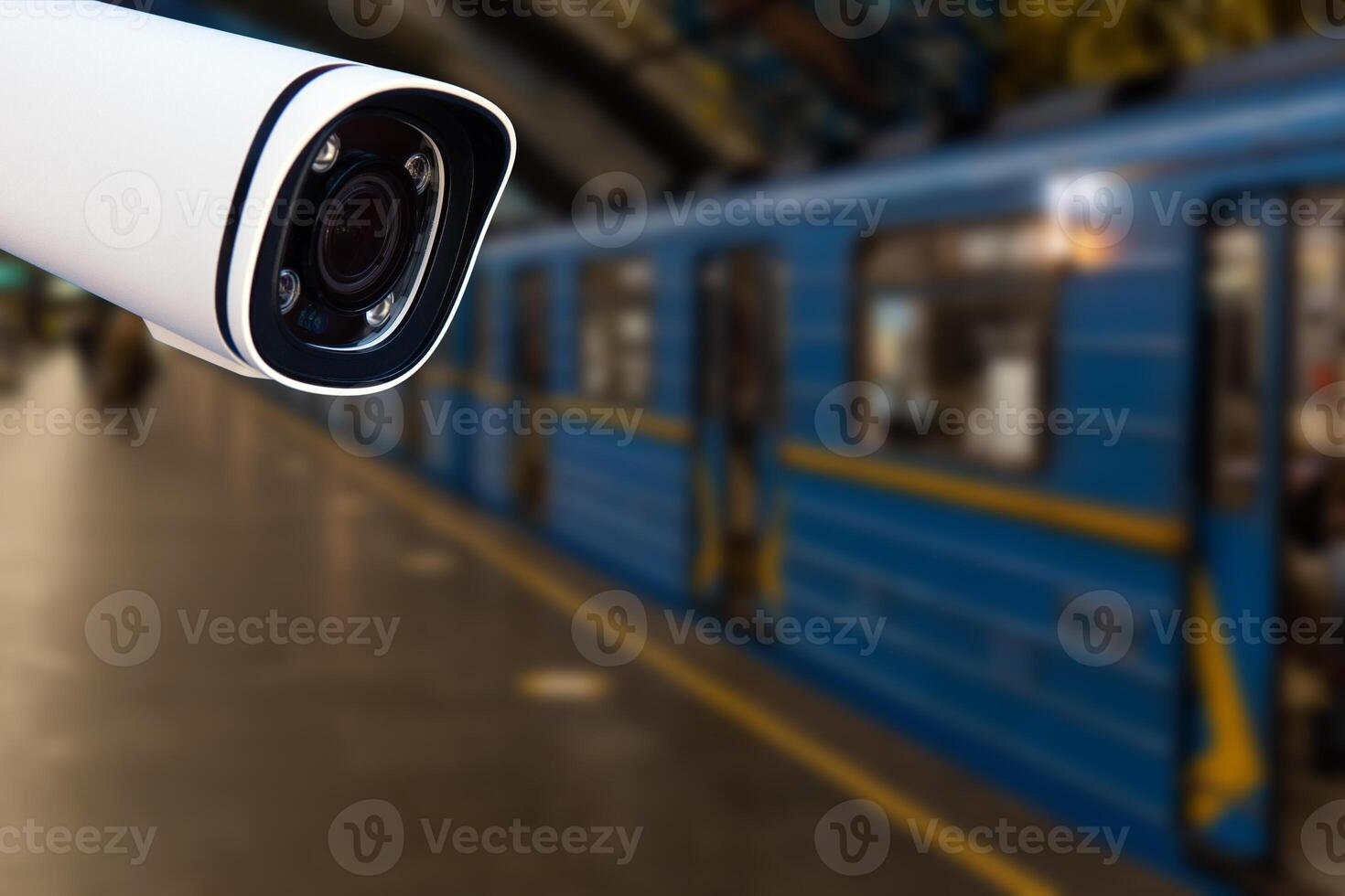 CCTV surveillance camera at railway station.Security system camera for protecting people from crime.Privacy monitor equipment in for police monitoring people in subway station photo