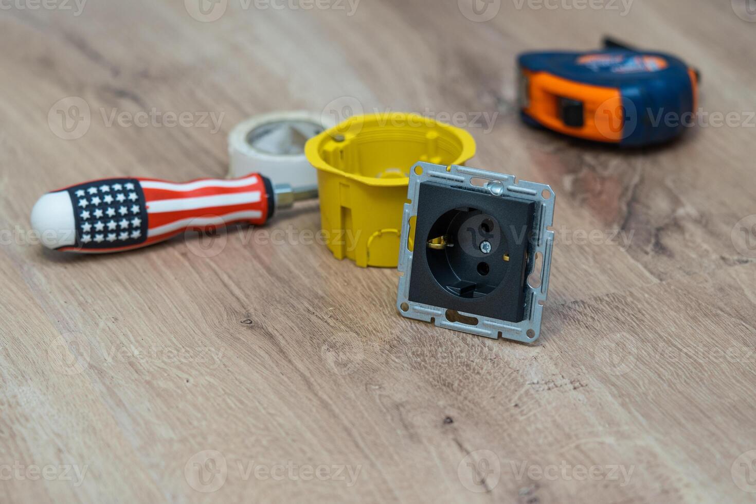Components for use in electrical installations. Distribution box, socket, insulating tape. Engineering accessories, energy concept. photo