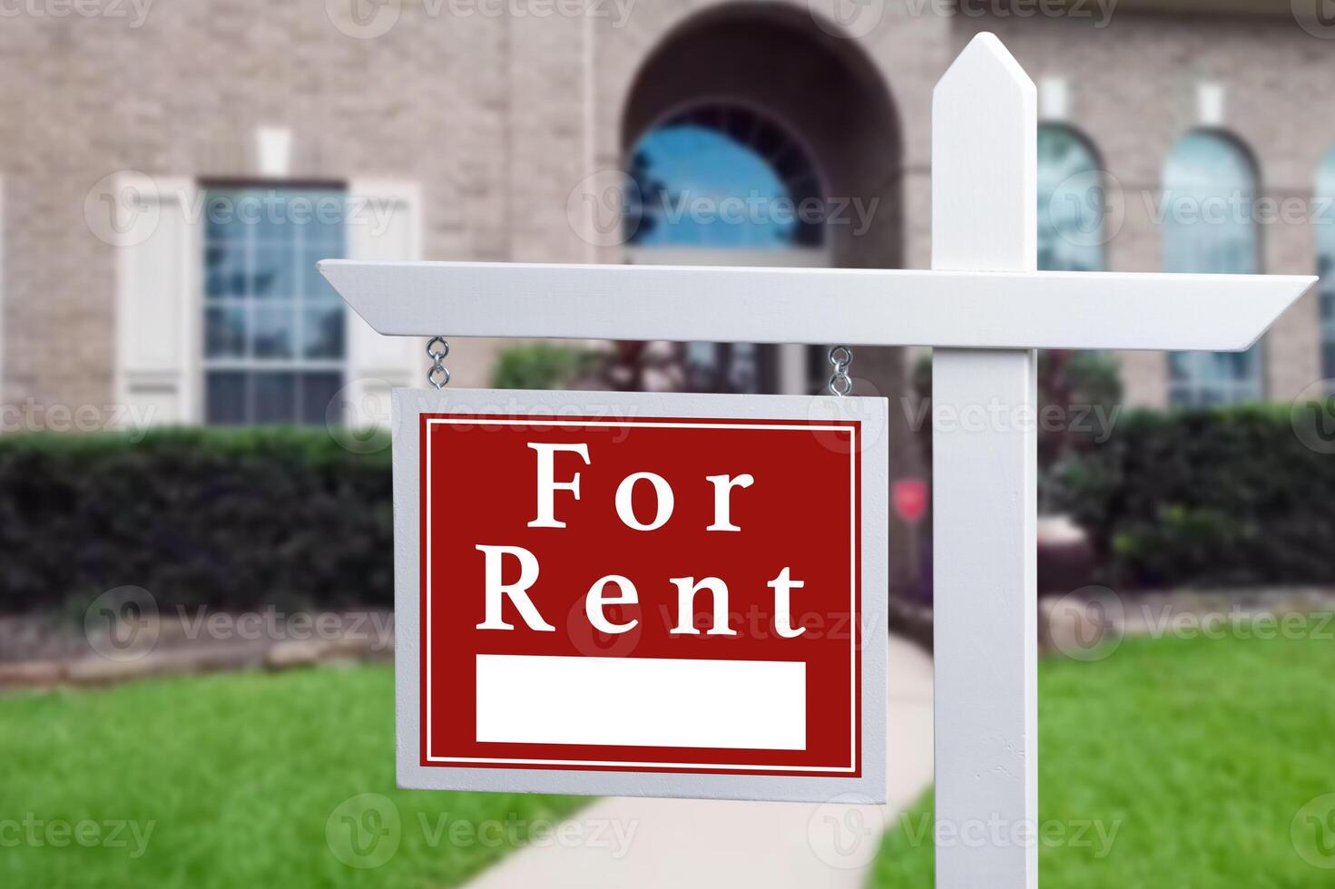 Home for rent. Sign in front of new home. photo