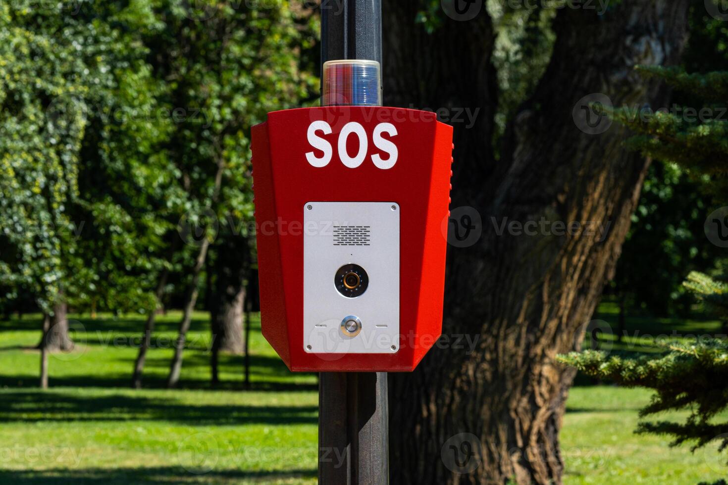 SOS, police, emergency button in the public park photo