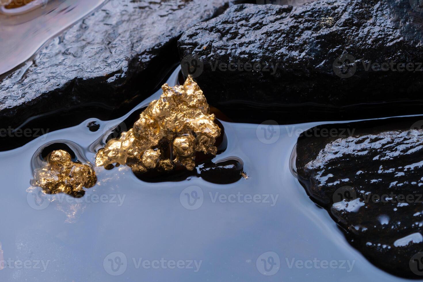 Pure gold ore found in mines with natural water sources . photo