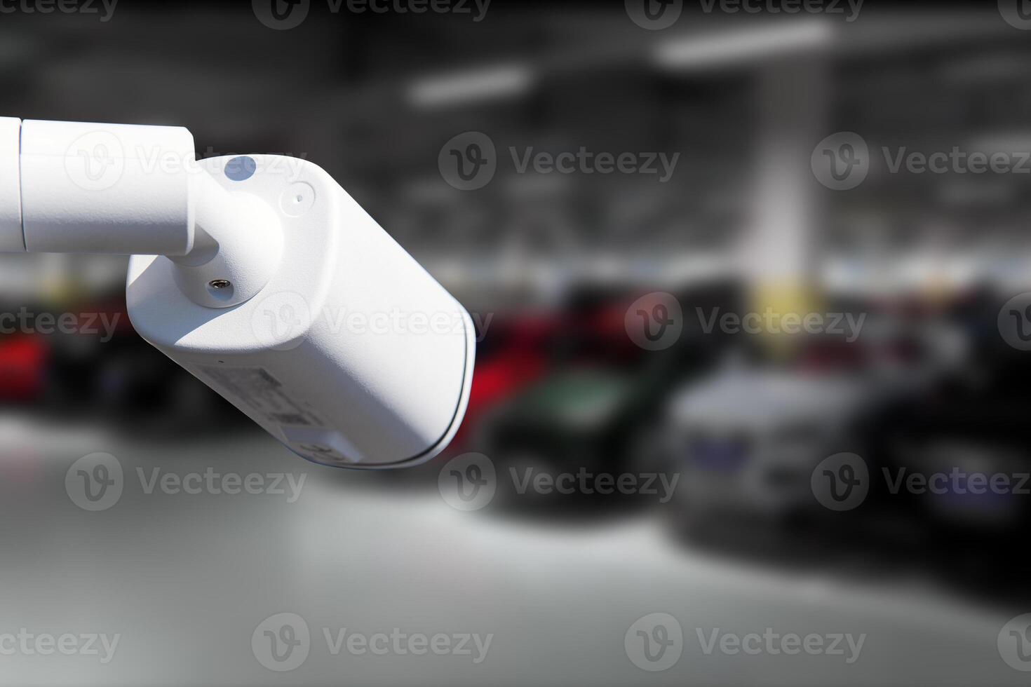 CCTV Camera Operating in car park building. Copy space. photo