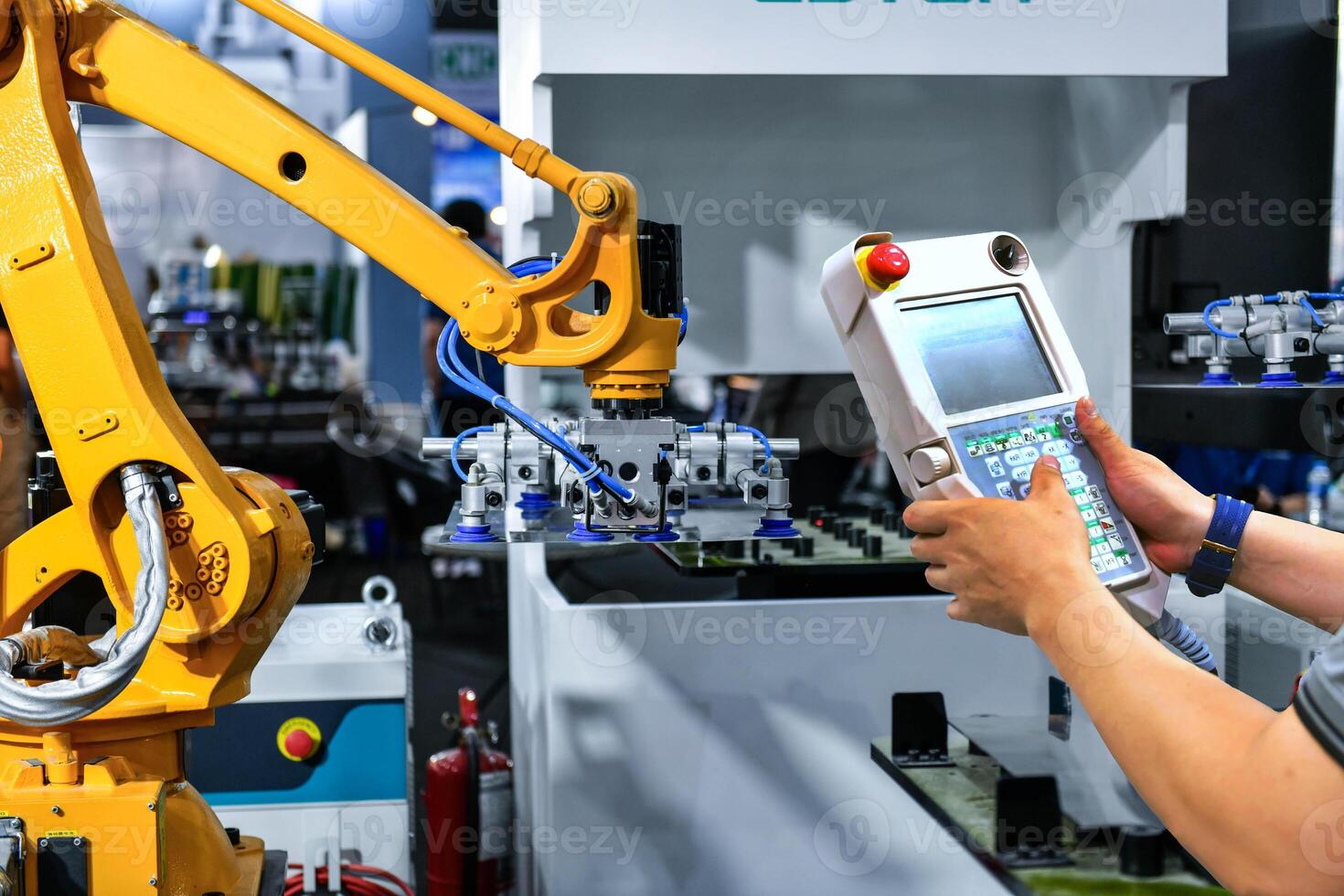A worker is pressing a steel plan control button to enter the steel cutting process in the industrial factory photo