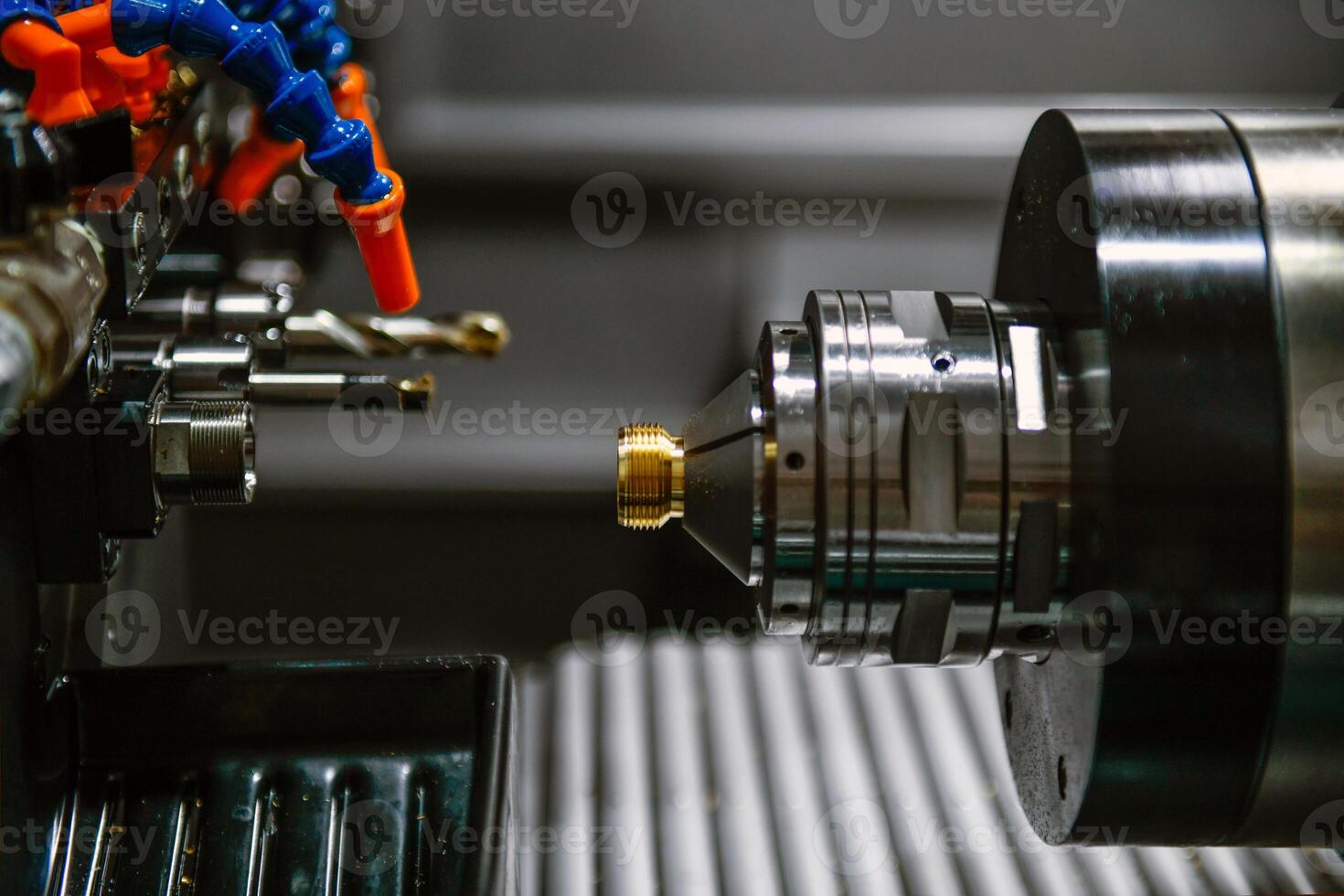 The CNC lathe machine thread cutting the screw metal shaft parts photo