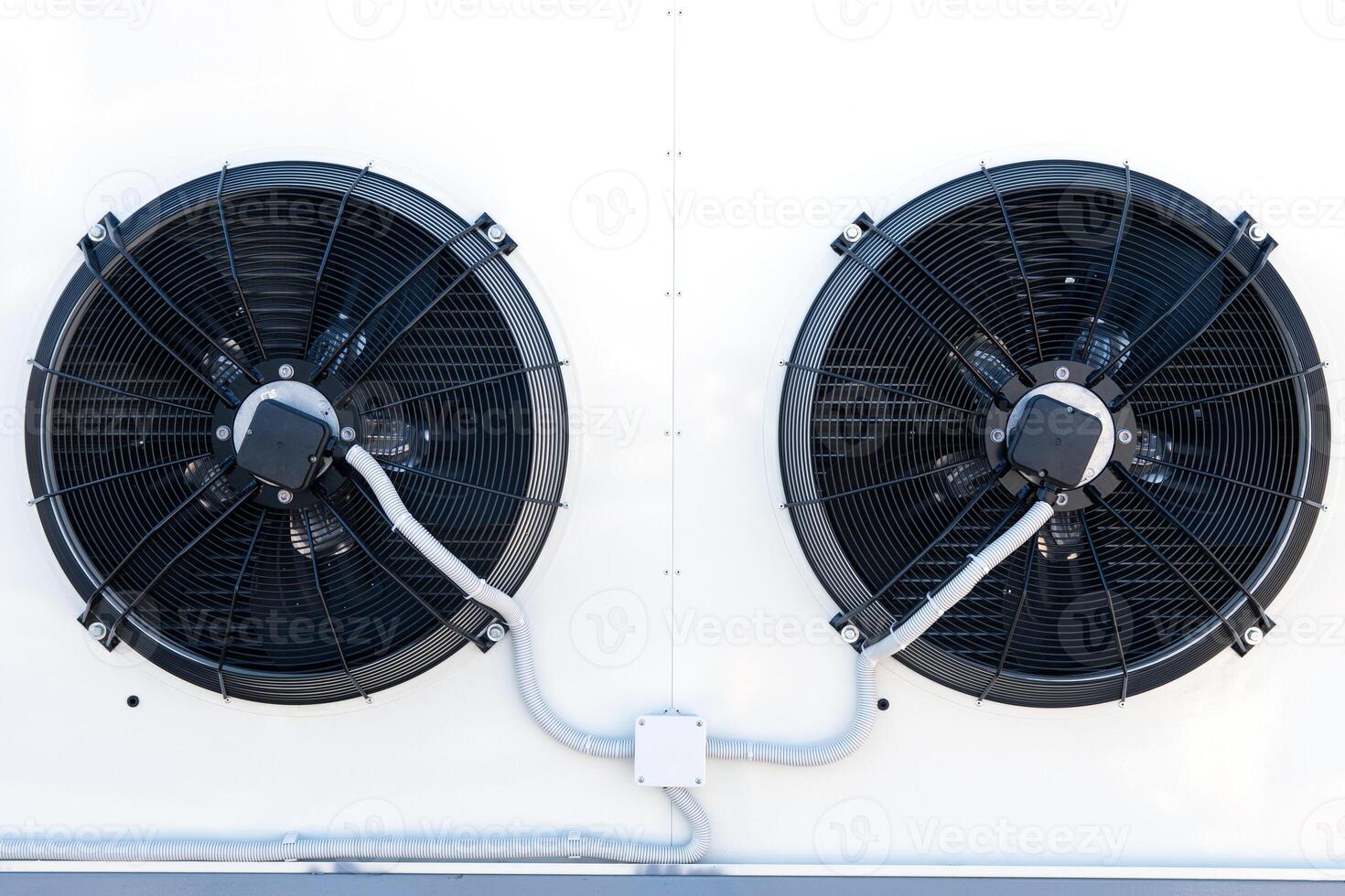 The air conditioning system is assembled on the side of the building photo
