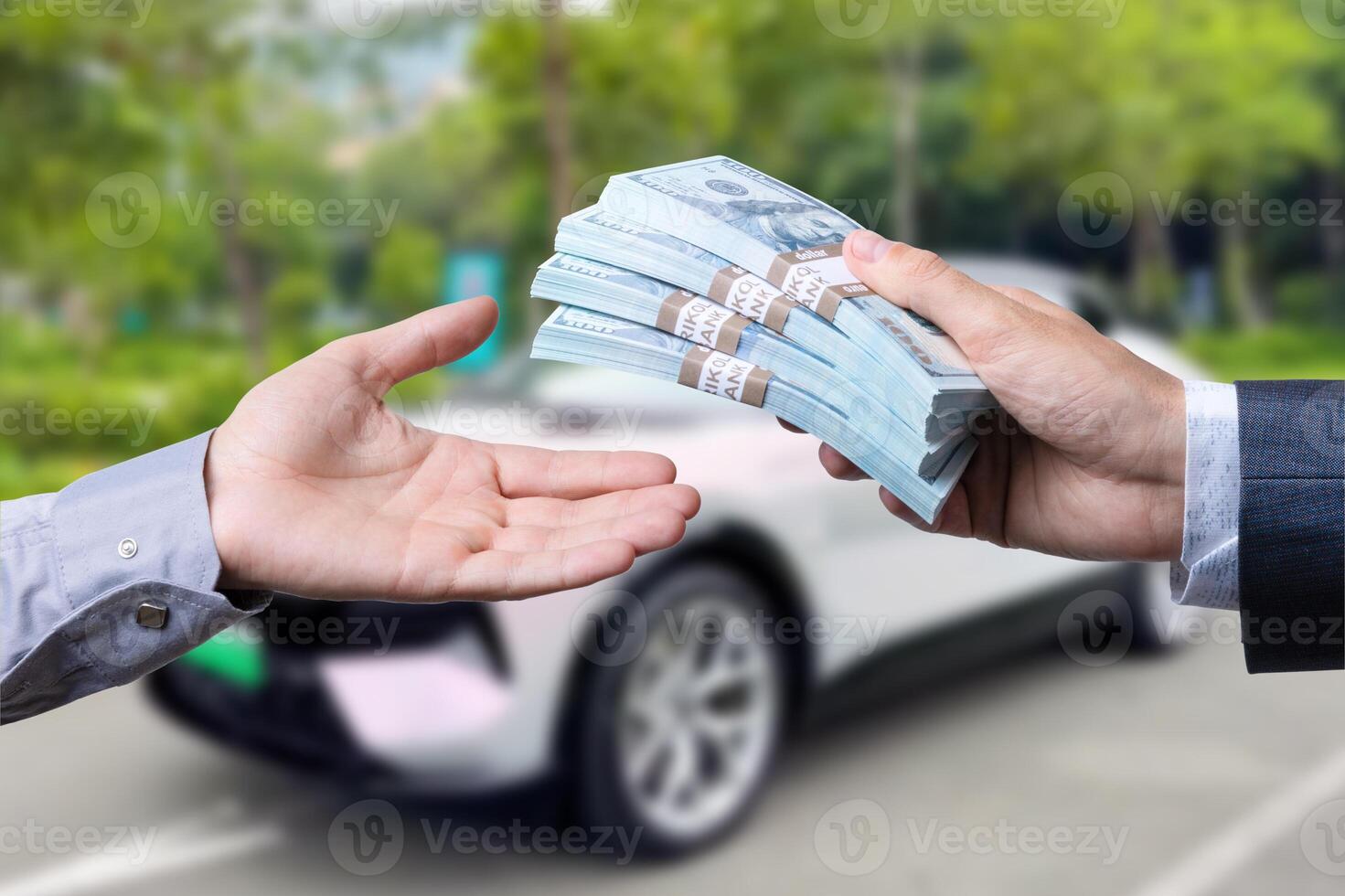 Purchase deal of buy or rent new car. Hand with dollar money and car keys. finance. photo