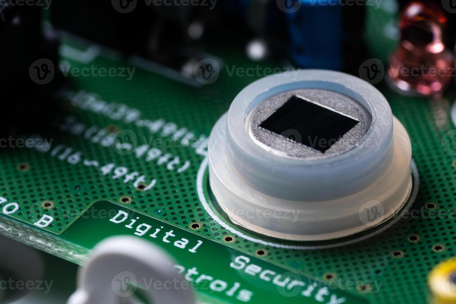 Close-up of the motion sensor of security systems on the electronic board. photo