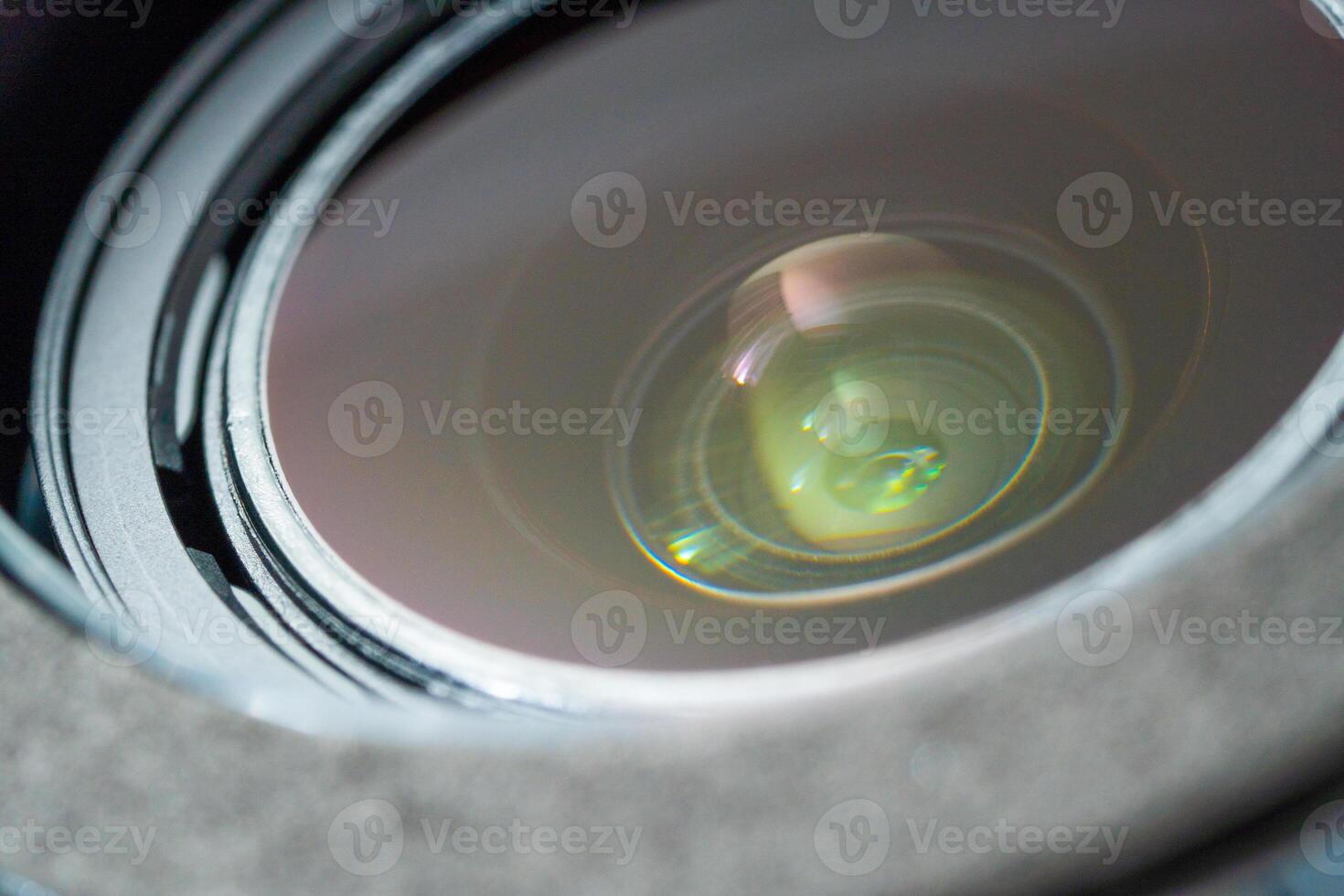 Close up beautiful camera lens with colorful background reflection. photo