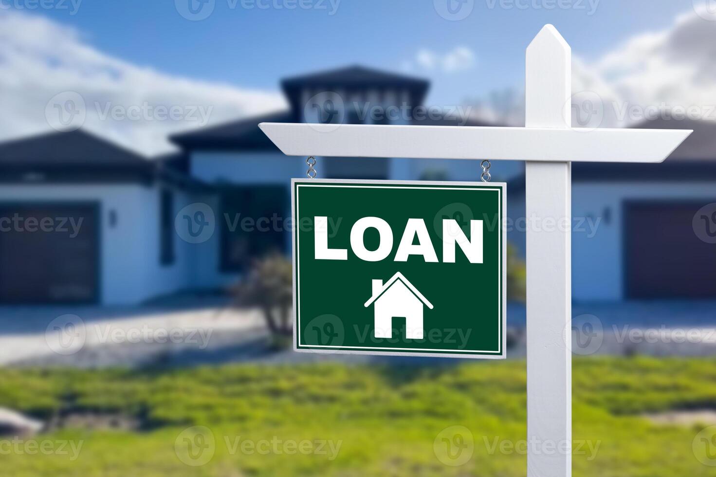 LOAN sign against a house. Close-up. photo