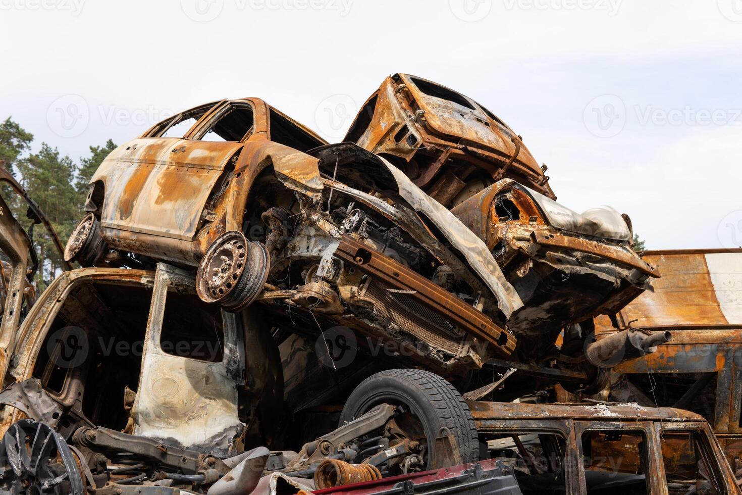 war in Ukraine. Car graveyard. Cars of civilians were shot. Russia's war against Ukraine. Burnt and blown up car. Cars damaged after shelling. irpin bucha. war crimes photo