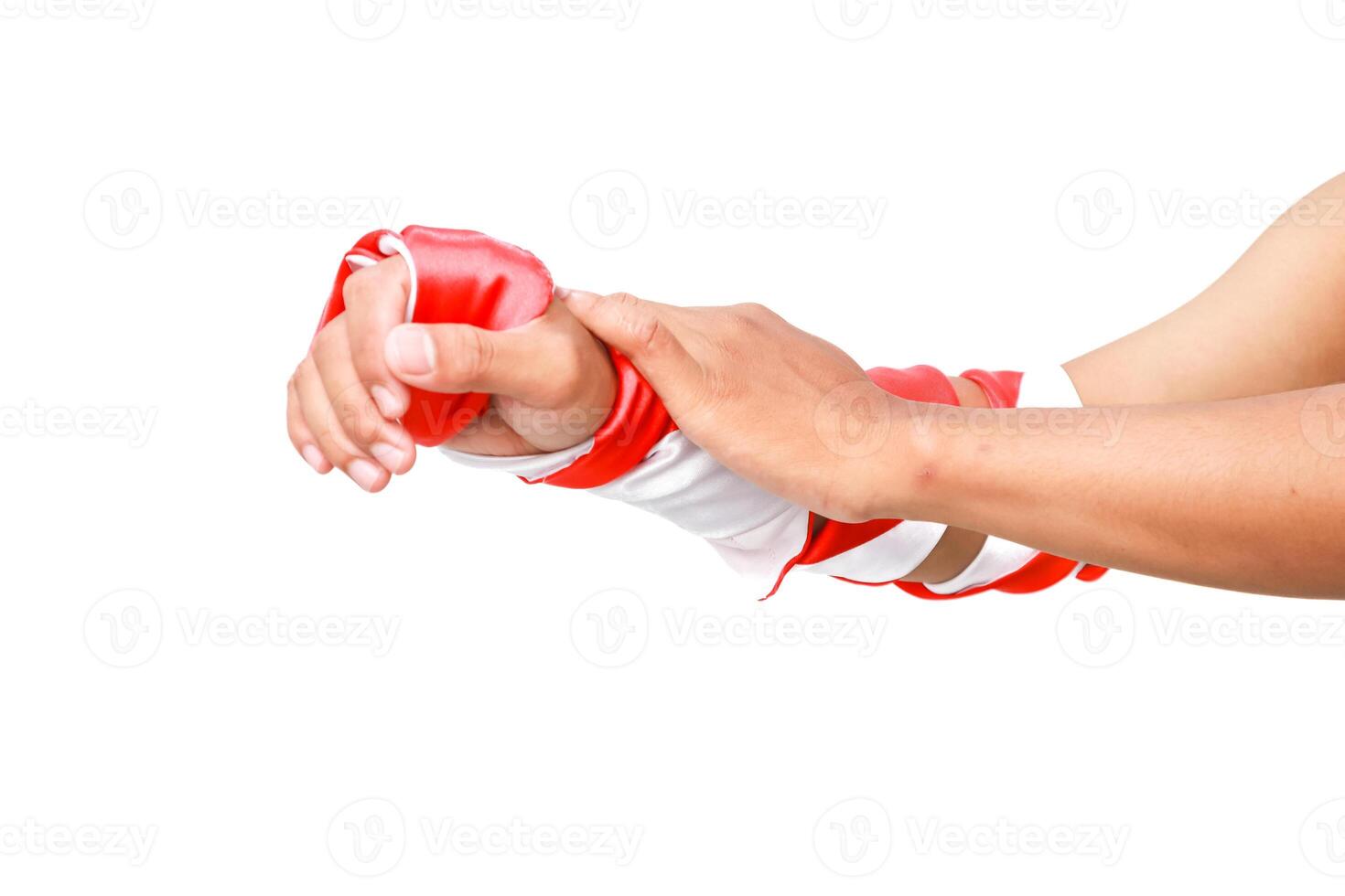 Close-up of hands and arm wearing a red and white striped sleeve on a white background photo