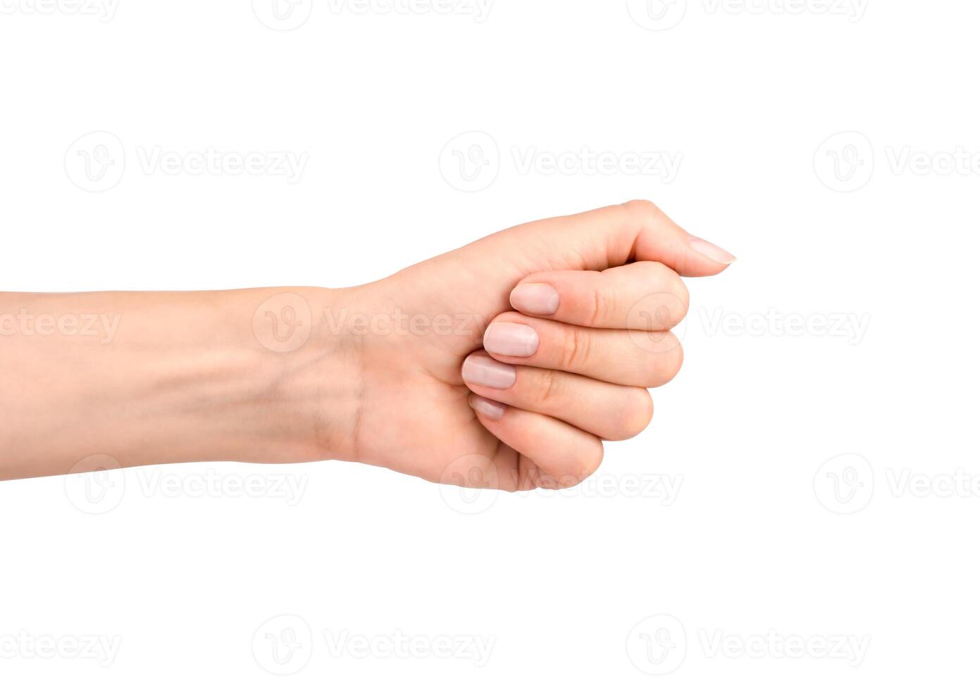 A woman's hand shows a fist isolated on white background. Close-up. photo