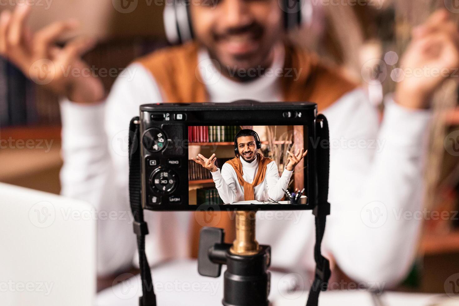 E-Teacher Man Making Lecture For His Educational Blog Recording Lecture Sitting Indoors, Focus On Camera. Online Teaching And E-Learning, Modern Distance Education. Shallow Depth photo