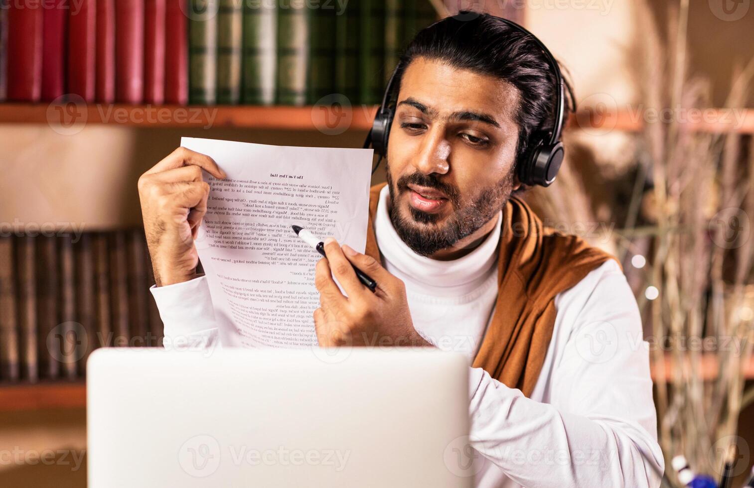 Distant Teaching And Learning. Arab Teacher Guy At Laptop Having Online Class With Remote Students Sitting Indoors. School And College Education Remotely, Modern Tutoring And E-Learning. photo