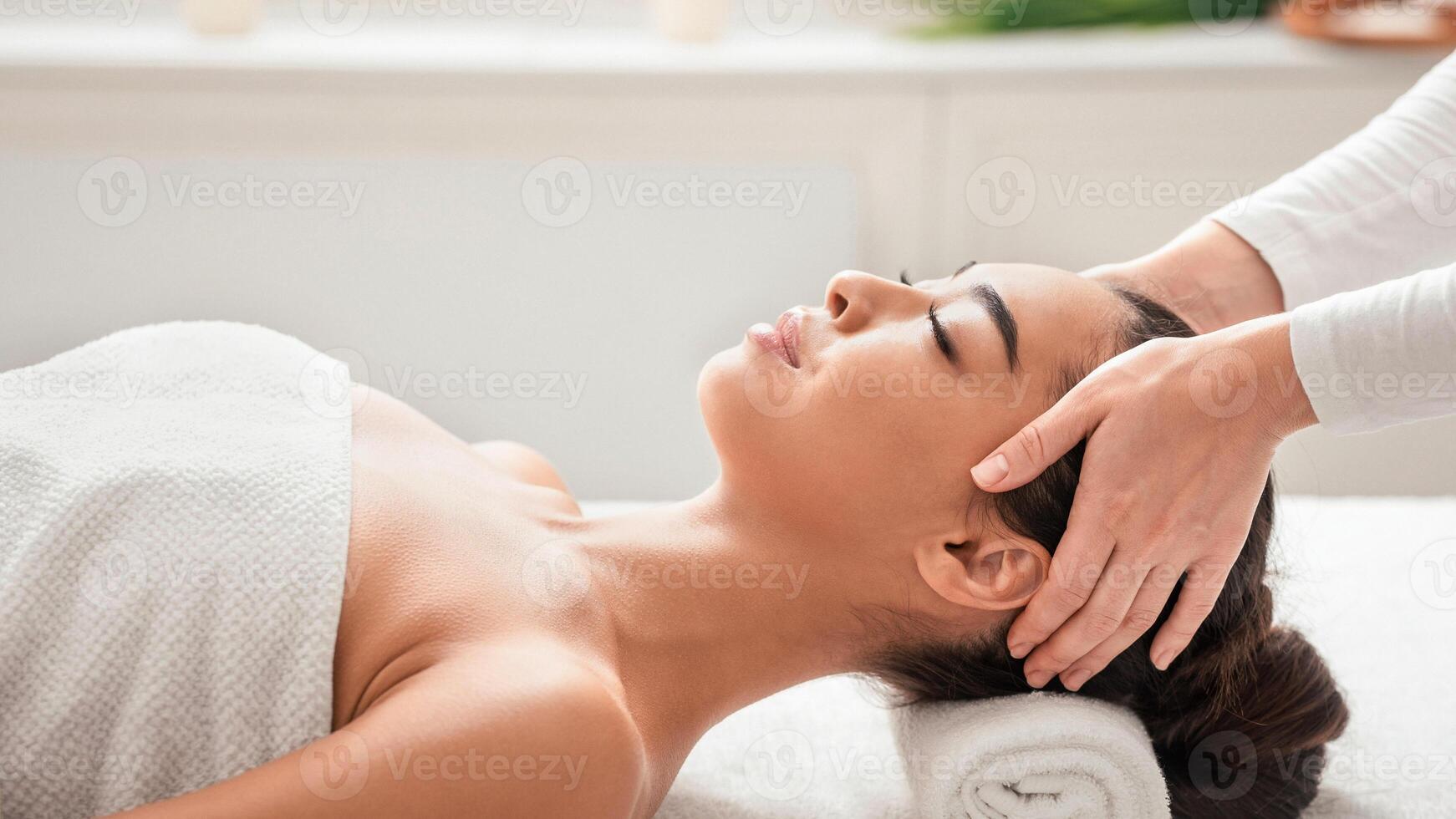 Relaxed asian lady getting head massage in spa salon, enjoying beauty treatment therapy, lying on table with closed eyes, enjoying wellness day at cosmetology cabinet, closeup shot with free space photo