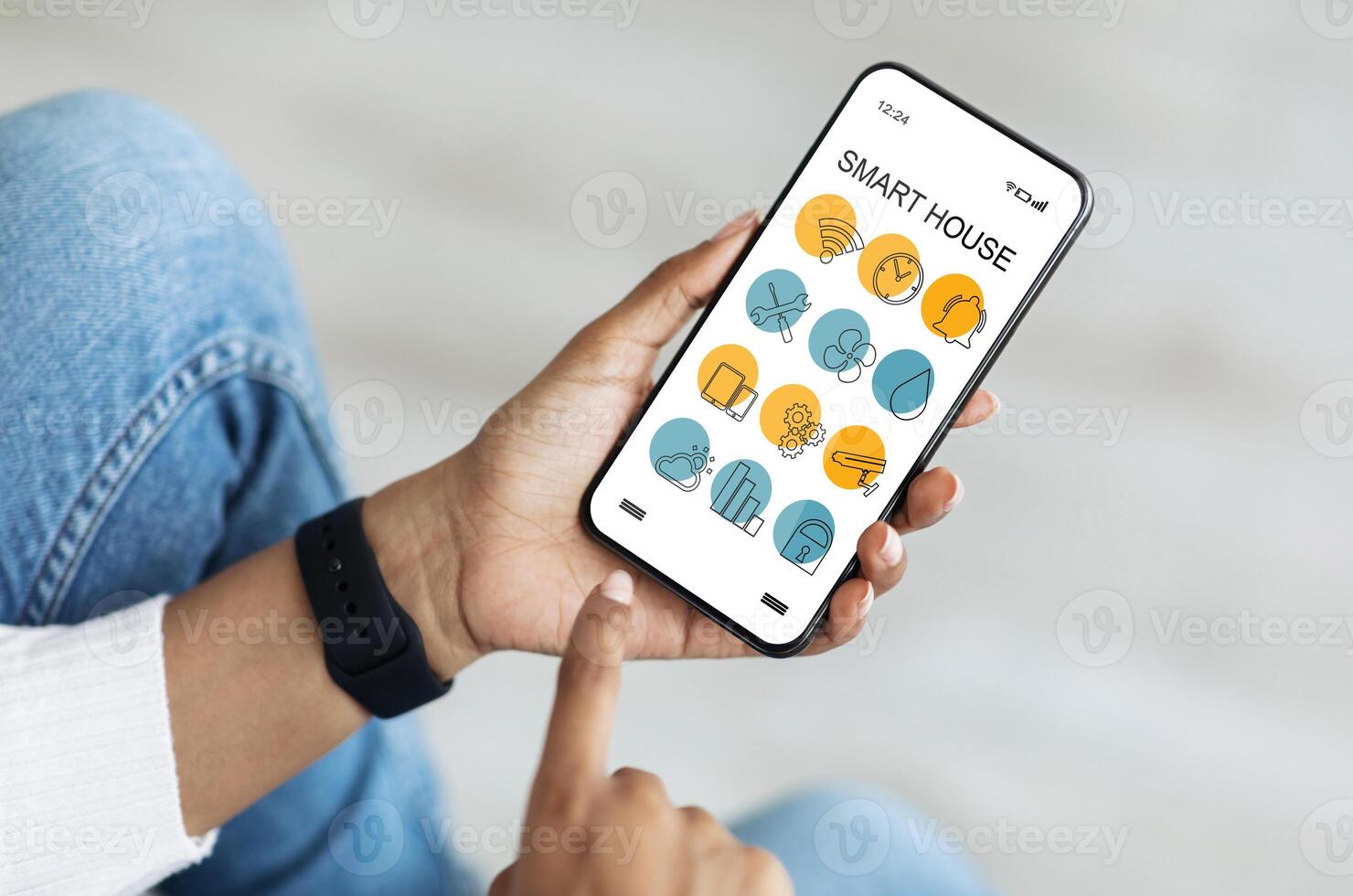 Cellphone with Smart home app in unrecognizable black lady hands, creative image for modern technologies and household. African american woman using smart house software on mobile phone, cropped photo