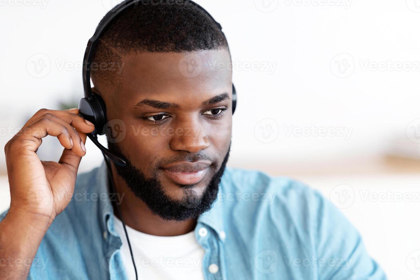 Closeup Portrait Of Handsome Black Male Hotline Operator In Headset, Young African American Customer Support Manager In Headphones Consulting Client, Working At Home Office, Free Space photo