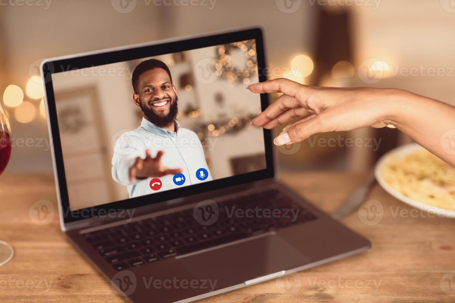 Long Distance Relationship. African american couple having online virtual date, reaching hands to each other to webcam in videochat with videoconferencing app window. Remote Dating During Pandemic. photo