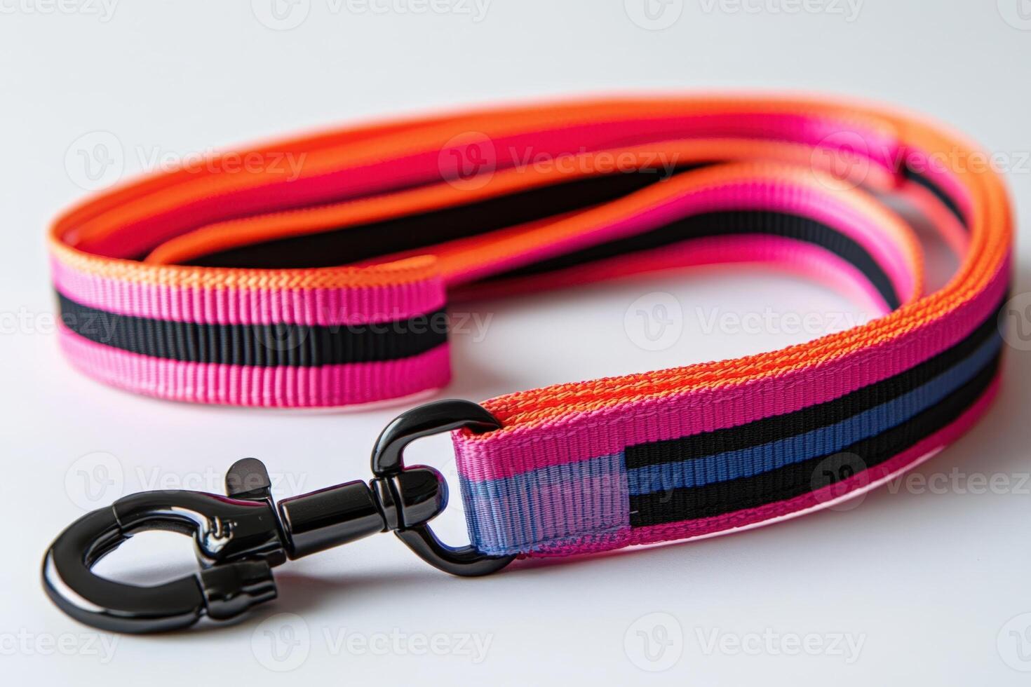 A pink and black dog leash with a black metal hook photo
