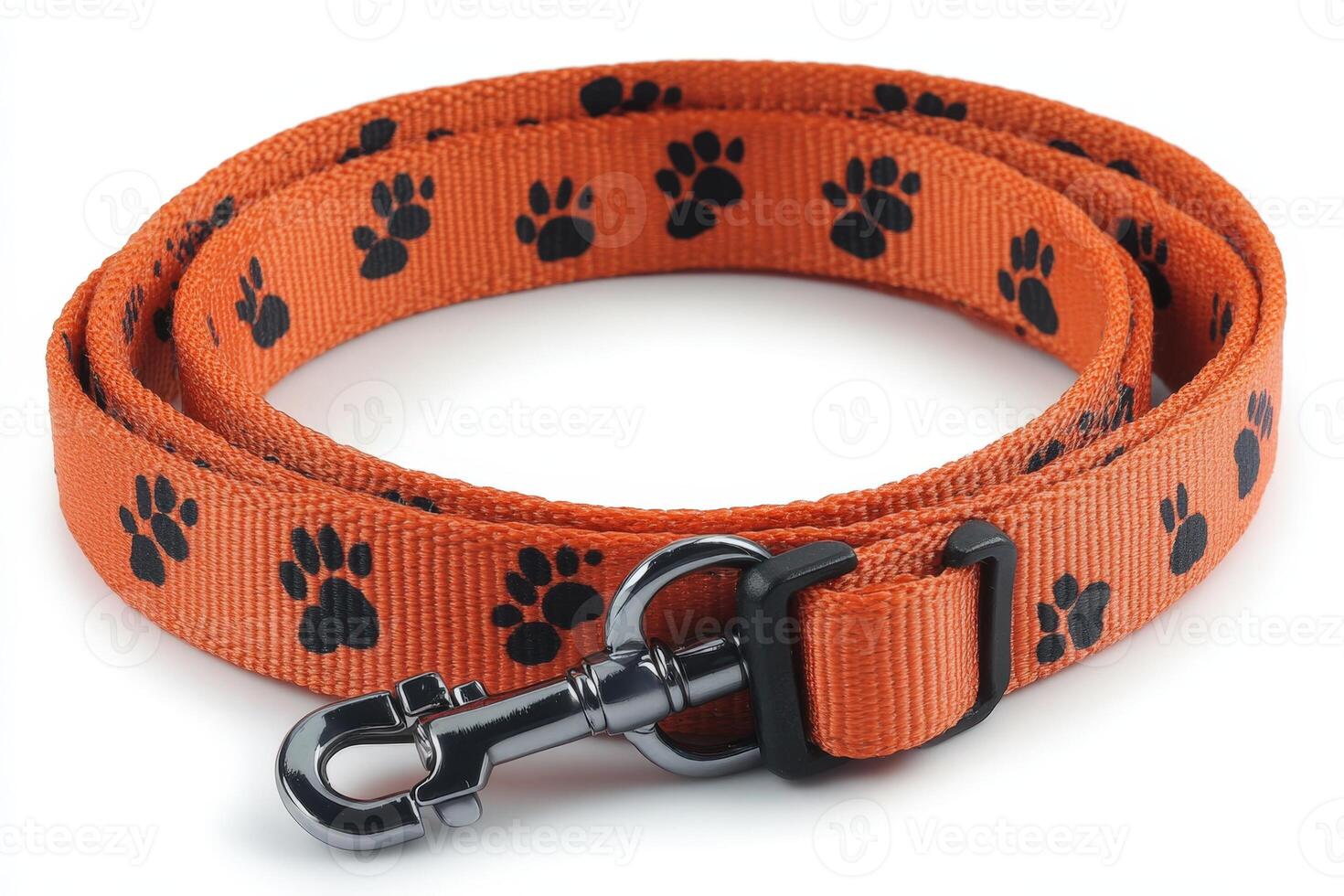 An orange dog leash with black paw prints photo