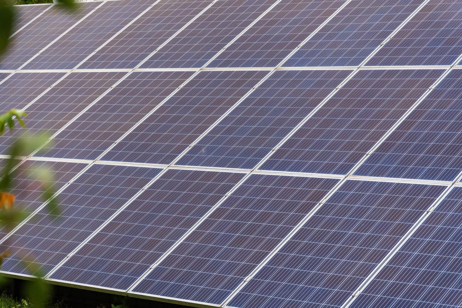 Solar panels installed on a rooftop efficiently convert sunlight into electricity, showcasing renewable energy technology on a bright sunny day photo