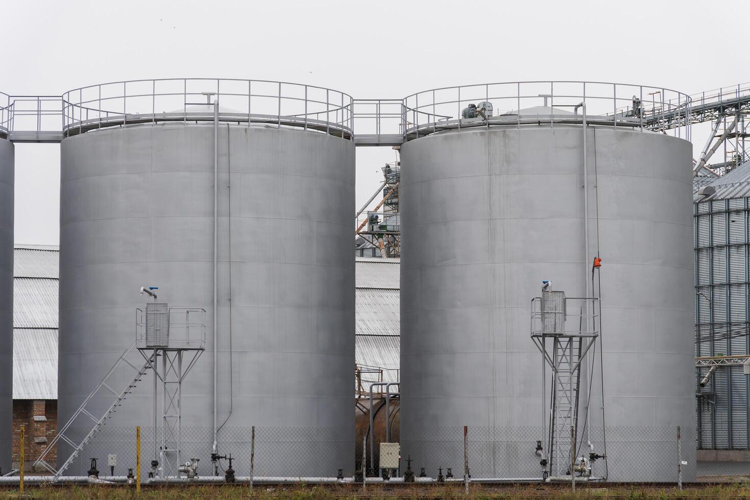 This agro-processing facility features several large silos designed for storing harvested grains. The silos are integral to grain storage and processing operations photo