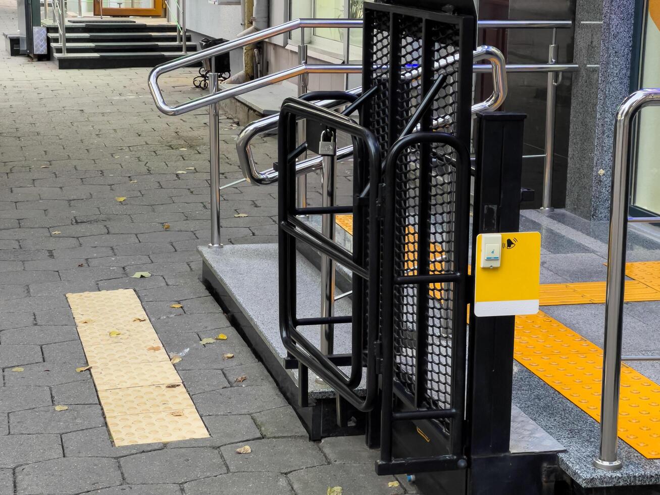 The entrance showcases a well-designed wheelchair ramp complemented by clear signage, ensuring easy access for individuals with mobility challenges photo