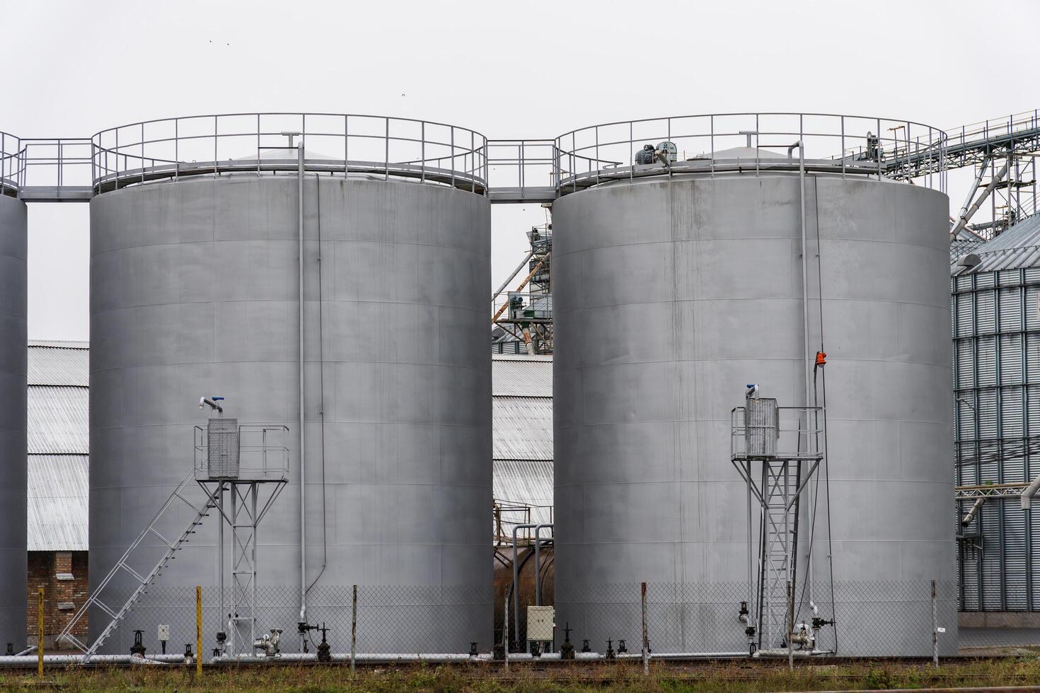 A state-of-the-art agro-processing facility dedicated to the drying, cleaning, and storage of various agricultural products, showcasing large silos for grain photo