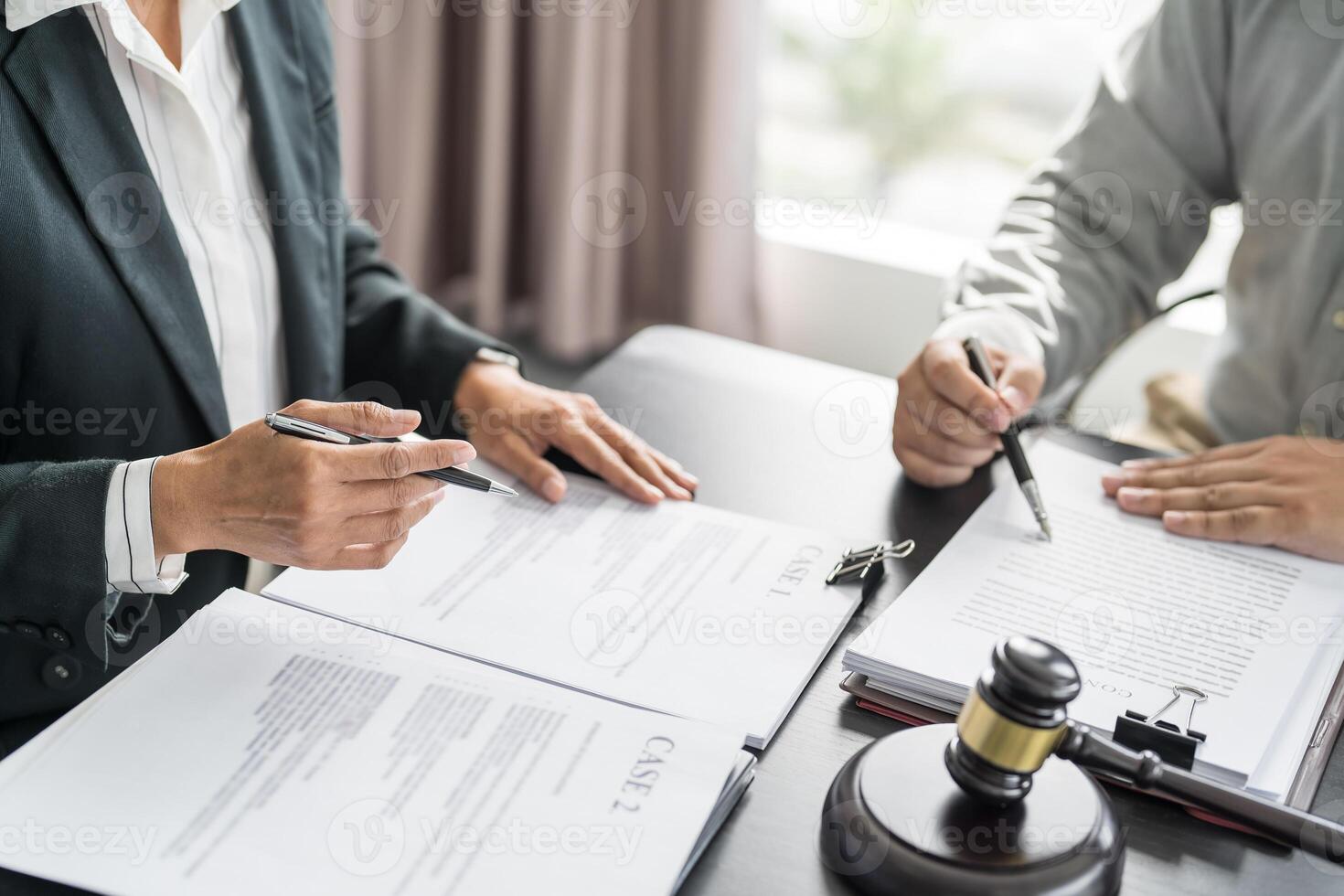 Lawyer Legal counsel presents to the client signed contract with gavel and legal law justice and lawyer Business partnership meeting. photo