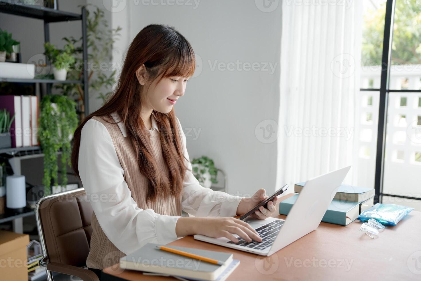 student woman using laptop to study student engaged in online learning at college photo