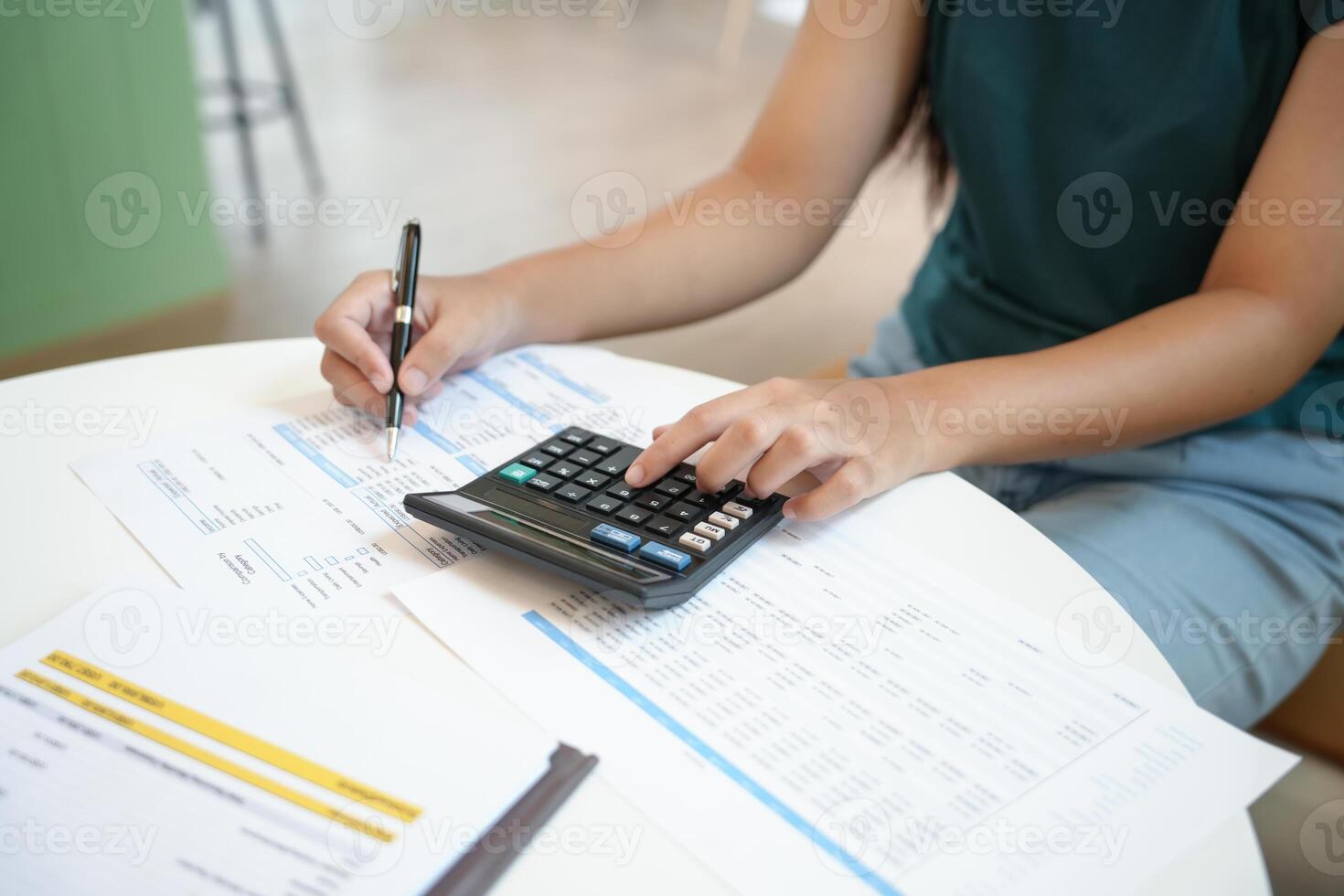 woman doing taxes at home photo