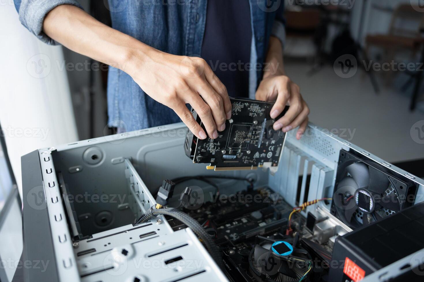 engineer is holding a computer motherboard photo