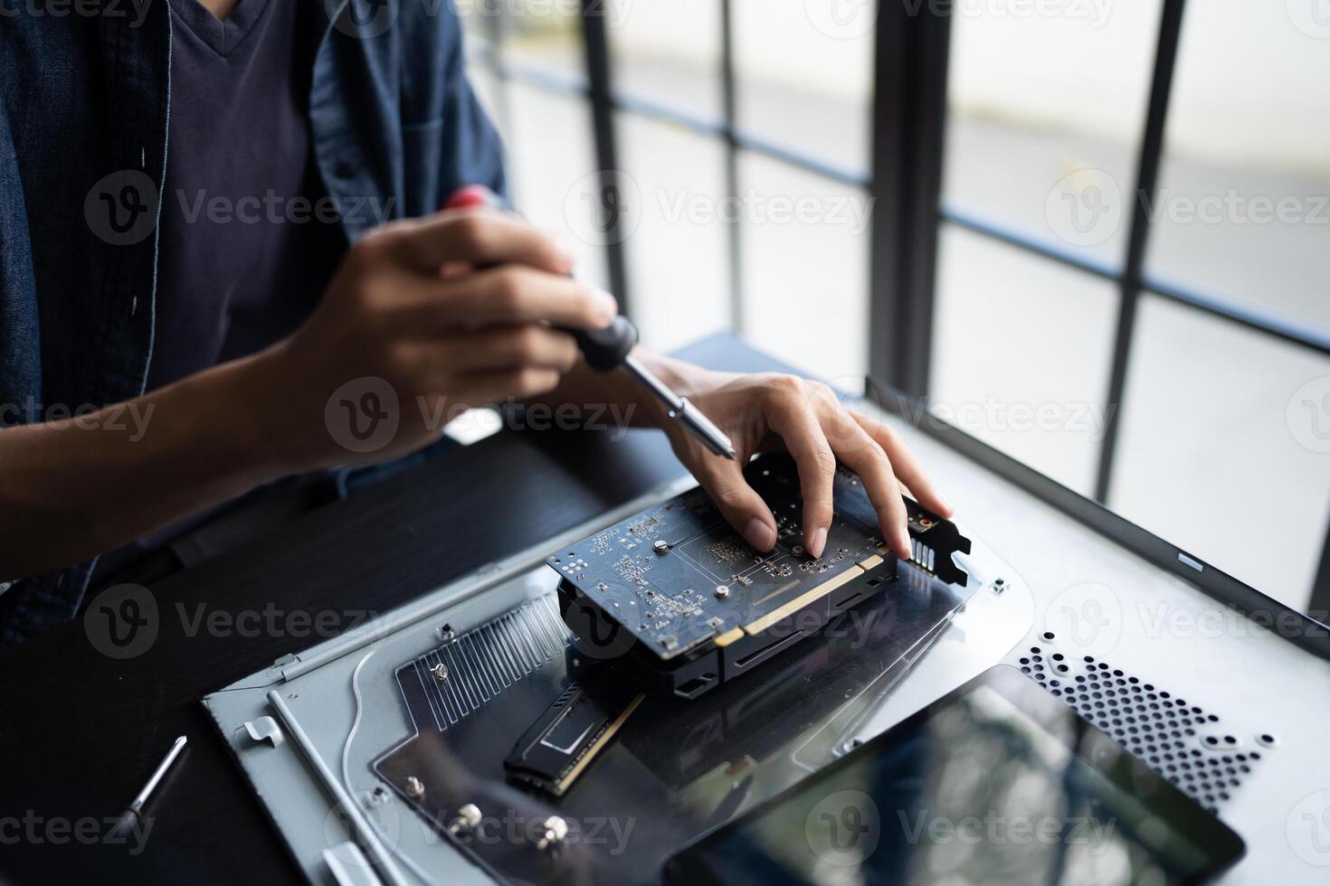 IT Engineer working on a laptop computer photo
